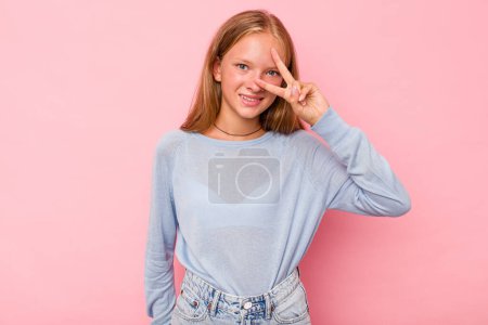 Photo for Caucasian teen girl isolated on pink background dancing and having fun. - Royalty Free Image