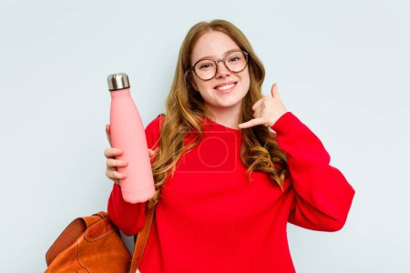 Photo for Young student woman holding a canteen isolated on blue background showing a mobile phone call gesture with fingers. - Royalty Free Image