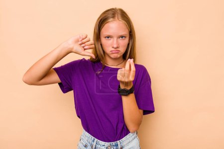 Photo for Caucasian teen girl isolated on beige background showing that she has no money. - Royalty Free Image