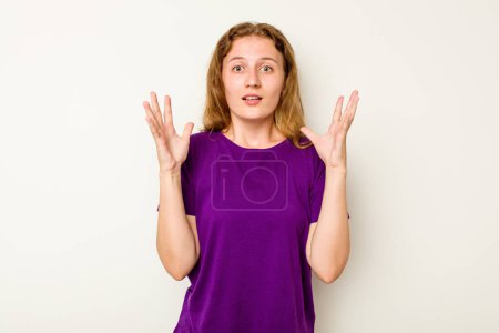 Photo for Young caucasian woman isolated on white background screaming to the sky, looking up, frustrated. - Royalty Free Image