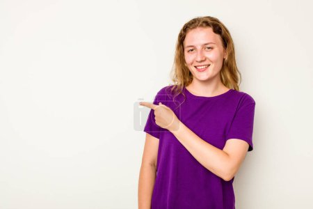 Photo for Young caucasian woman isolated on white background smiling and pointing aside, showing something at blank space. - Royalty Free Image