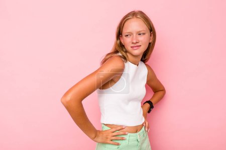 Photo for Caucasian teen girl isolated on pink background suffering a back pain. - Royalty Free Image