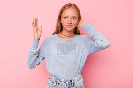 Photo for Caucasian teen girl isolated on pink background screaming with rage. - Royalty Free Image