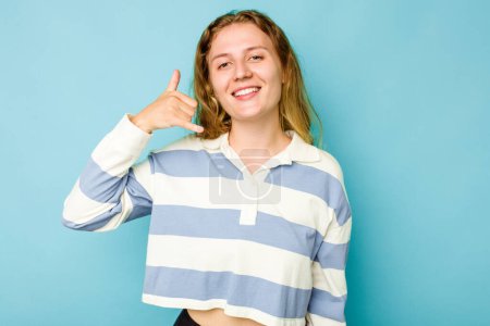 Photo for Young caucasian woman isolated on blue background showing a mobile phone call gesture with fingers. - Royalty Free Image
