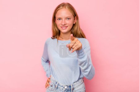 Photo for Caucasian teen girl isolated on pink background cheerful smiles pointing to front. - Royalty Free Image