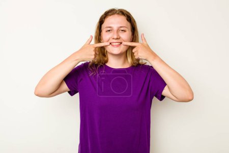 Photo for Young caucasian woman isolated on white background smiles, pointing fingers at mouth. - Royalty Free Image