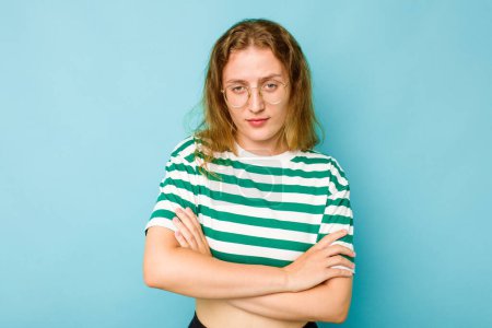 Photo for Young caucasian woman isolated on blue background unhappy looking in camera with sarcastic expression. - Royalty Free Image