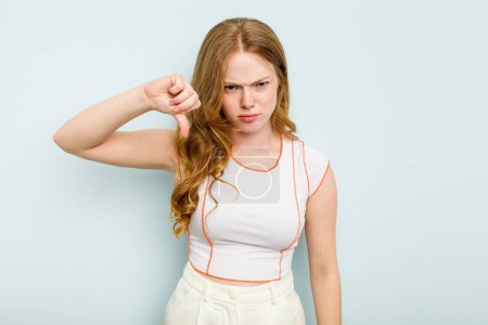 Photo for Young caucasian woman isolated on blue background showing thumb down and expressing dislike. - Royalty Free Image