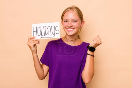 Photo for Little caucasian girl holding holidays placard isolated on beige background - Royalty Free Image