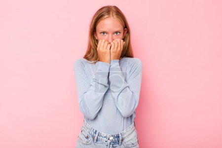 Photo for Caucasian teen girl isolated on pink background biting fingernails, nervous and very anxious. - Royalty Free Image