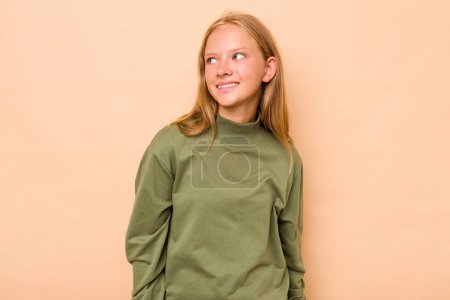 Photo for Caucasian teen girl isolated on beige background relaxed and happy laughing, neck stretched showing teeth. - Royalty Free Image