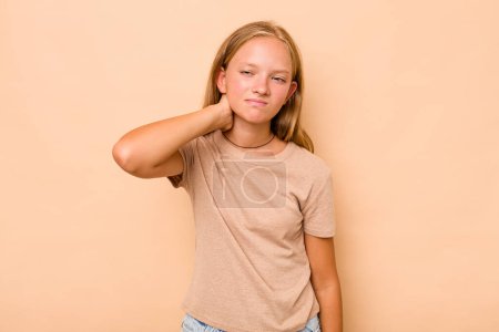 Photo for Caucasian teen girl isolated on beige background having a neck pain due to stress, massaging and touching it with hand. - Royalty Free Image