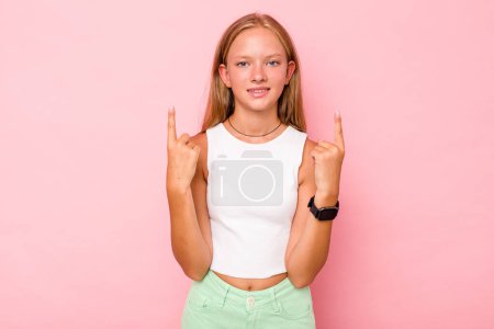 Photo for Caucasian teen girl isolated on pink background indicates with both fore fingers up showing a blank space. - Royalty Free Image