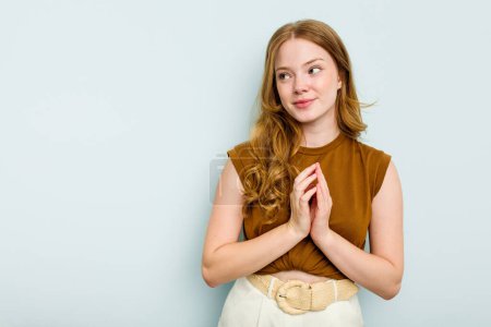 Photo for Young caucasian woman isolated on blue background making up plan in mind, setting up an idea. - Royalty Free Image