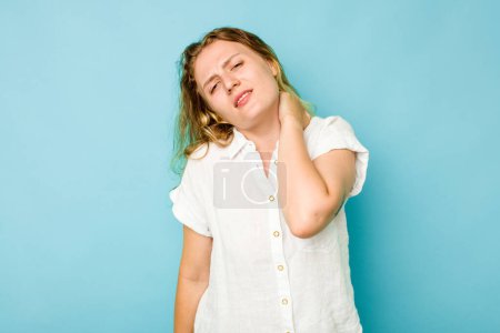Photo for Young caucasian woman isolated on blue background suffering neck pain due to sedentary lifestyle. - Royalty Free Image