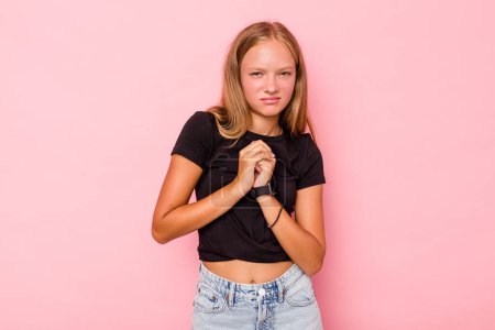 Photo for Caucasian teen girl isolated on pink background scared and afraid. - Royalty Free Image