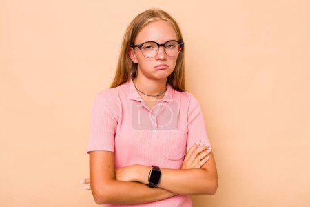 Photo for Caucasian teen girl isolated on beige background who is bored, fatigued and need a relax day. - Royalty Free Image