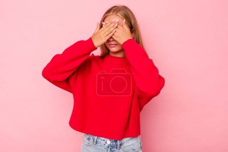 Photo for Caucasian teen girl isolated on pink background afraid covering eyes with hands. - Royalty Free Image