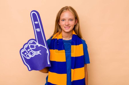 Photo for Little caucasian sports fan girl isolated on beige background happy, smiling and cheerful. - Royalty Free Image