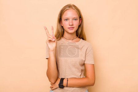Photo for Caucasian teen girl isolated on beige background showing number two with fingers. - Royalty Free Image