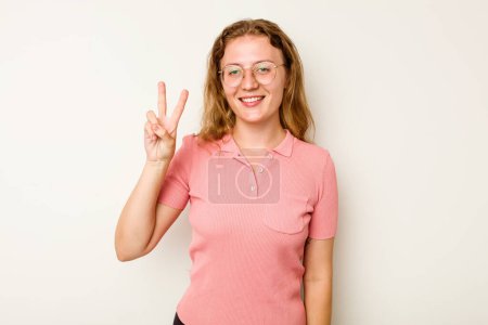 Photo for Young caucasian woman isolated on white background joyful and carefree showing a peace symbol with fingers. - Royalty Free Image