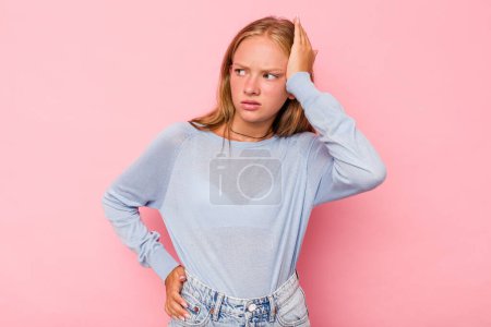 Photo for Caucasian teen girl isolated on pink background being shocked, she has remembered important meeting. - Royalty Free Image