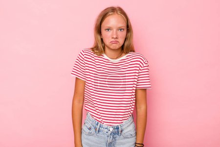 Photo for Caucasian teen girl isolated on pink background shrugs shoulders and open eyes confused. - Royalty Free Image
