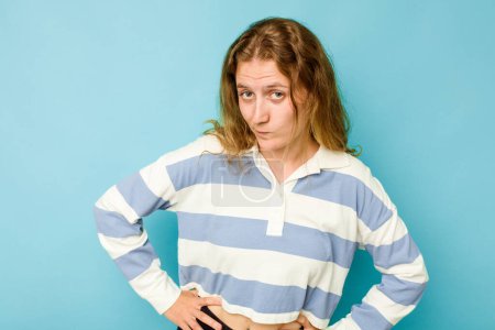 Photo for Young caucasian woman isolated on blue background confused, feels doubtful and unsure. - Royalty Free Image