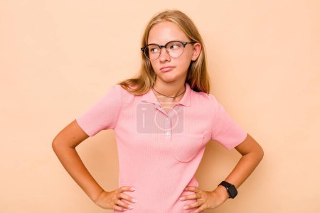 Photo for Caucasian teen girl isolated on beige background dreaming of achieving goals and purposes - Royalty Free Image