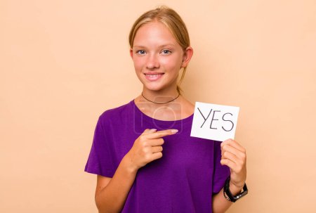 Photo for Little caucasian girl holding yes placard isolated on beige background - Royalty Free Image