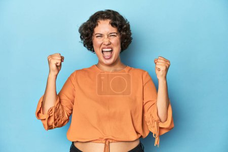 Photo for Young Caucasian woman with short hair cheering carefree and excited. Victory concept. - Royalty Free Image