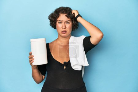 Photo for Young sportswoman with protein shake being shocked, she has remembered important meeting. - Royalty Free Image
