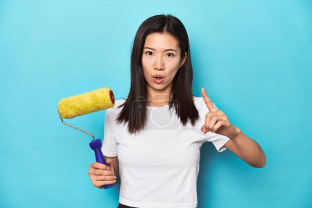 Photo for Young Asian woman with paint roller, DIY concept, having an idea, inspiration concept. - Royalty Free Image