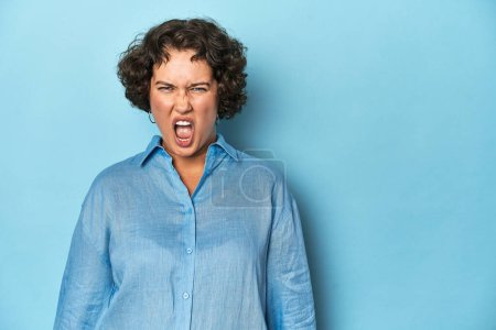 Photo for Young Caucasian woman with short hair shouting very angry, rage concept, frustrated. - Royalty Free Image
