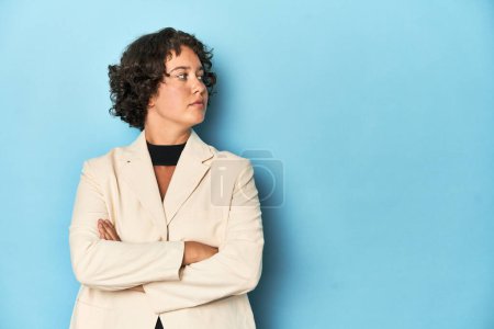 Photo for Young Caucasian woman in elegant white suit blazer, studio shot. - Royalty Free Image