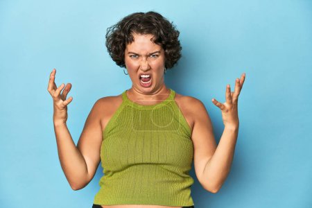 Photo for Young Caucasian woman with short hair screaming with rage. - Royalty Free Image