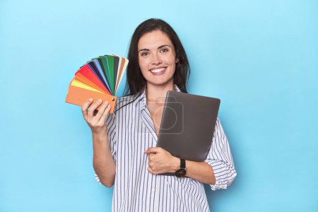 Photo for Graphic designer with laptop and color palette on blue - Royalty Free Image