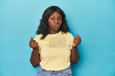 Photo for Young african american curvy woman showing that she has no money. - Royalty Free Image