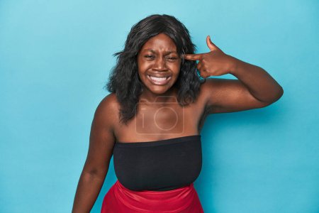 Photo for Young african american curvy woman showing a disappointment gesture with forefinger. - Royalty Free Image