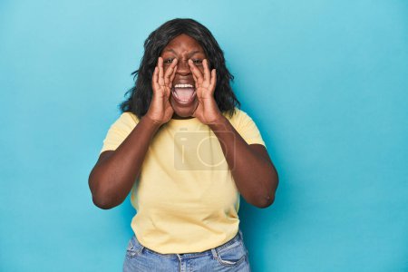 Photo for Young african american curvy woman shouting excited to front. - Royalty Free Image