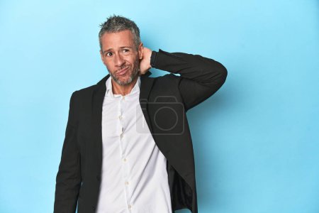 Photo for Caucasian businessman, middle-aged on blue background - Royalty Free Image