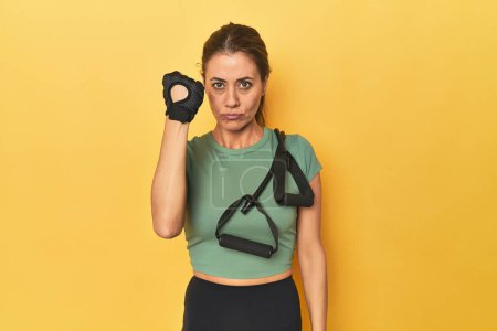 Photo for Portrait of adult woman showing fist to camera, aggressive facial expression. - Royalty Free Image