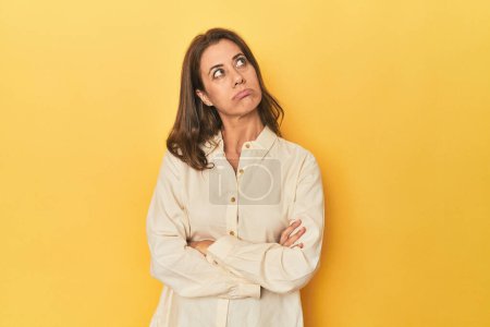 Photo for Portrait of adult woman tired of a repetitive task. - Royalty Free Image