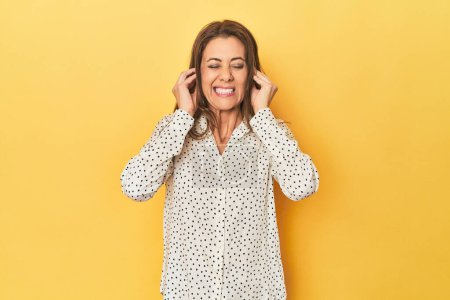 Photo for Portrait of beautiful adult woman covering ears with hands. - Royalty Free Image