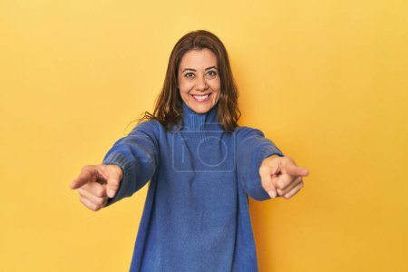 Photo for Portrait of beautiful adult woman cheerful smiles pointing to front. - Royalty Free Image