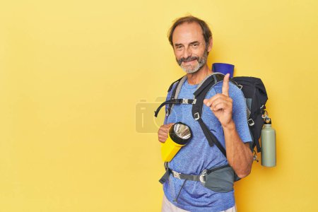 Photo for Hiker with backpack and lantern in studio - Royalty Free Image