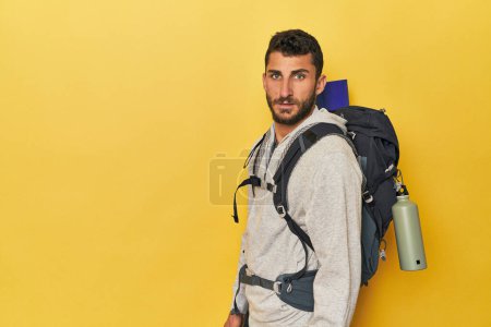 Photo for Young Hispanic man with canteen and backpack - Royalty Free Image
