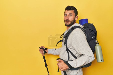 Photo for Hispanic man with backpack and hiking poles - Royalty Free Image