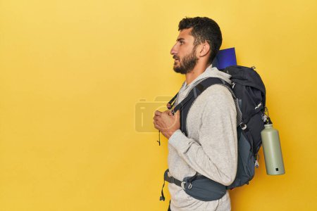 Photo for Young Hispanic man with canteen and backpack - Royalty Free Image