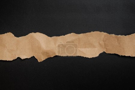 Photo for Ripped brown paper on background - Royalty Free Image